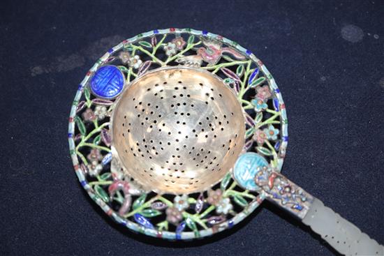 A Chinese white metal and enamel tea strainer, with pierced jade handle, 22cm.